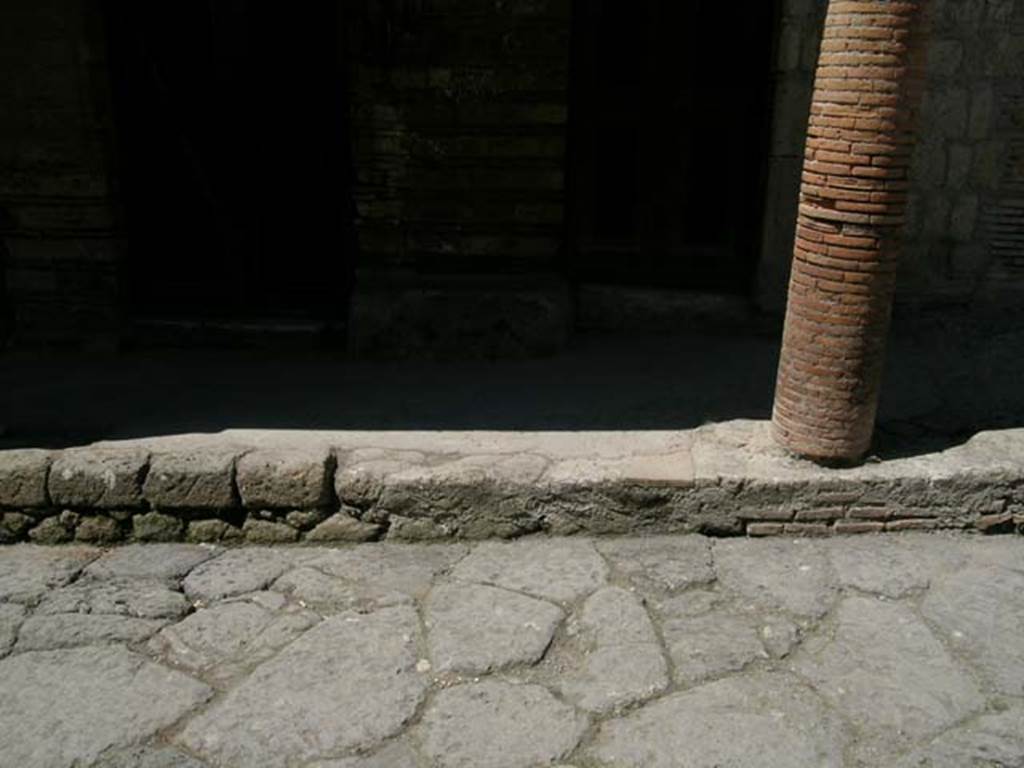 III.15/14/13, Herculaneum. April 2005. 
Looking west towards masonry column at northern end of balcony, and doorways at III.14 and III.13. 
Photo courtesy of Nicolas Monteix.